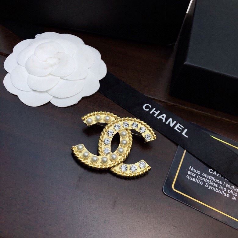 Ch*el brooches